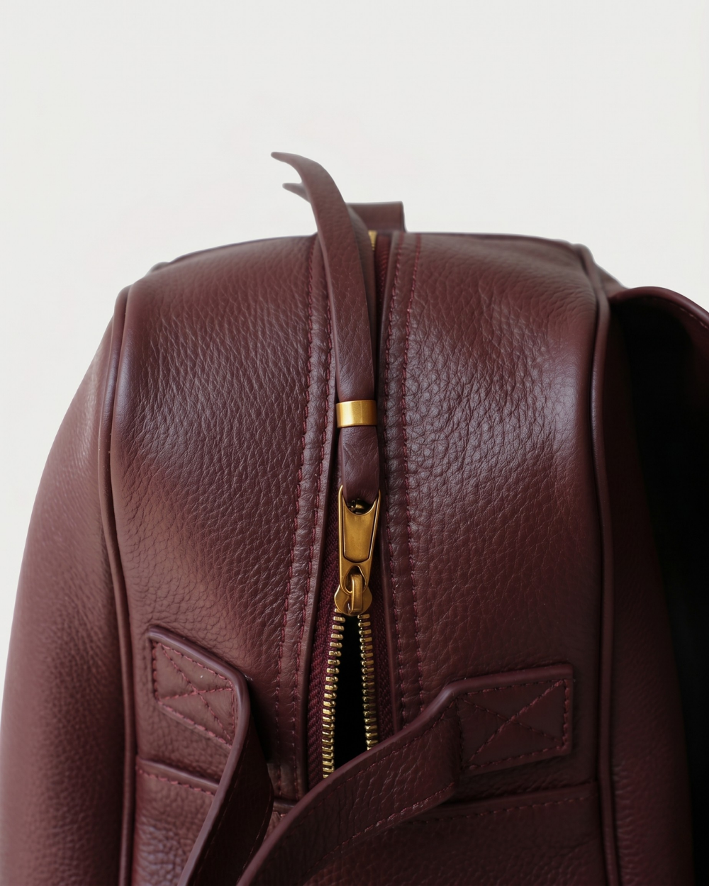Wine red pebbled leather texture close-up, Amélie Bowling Bag